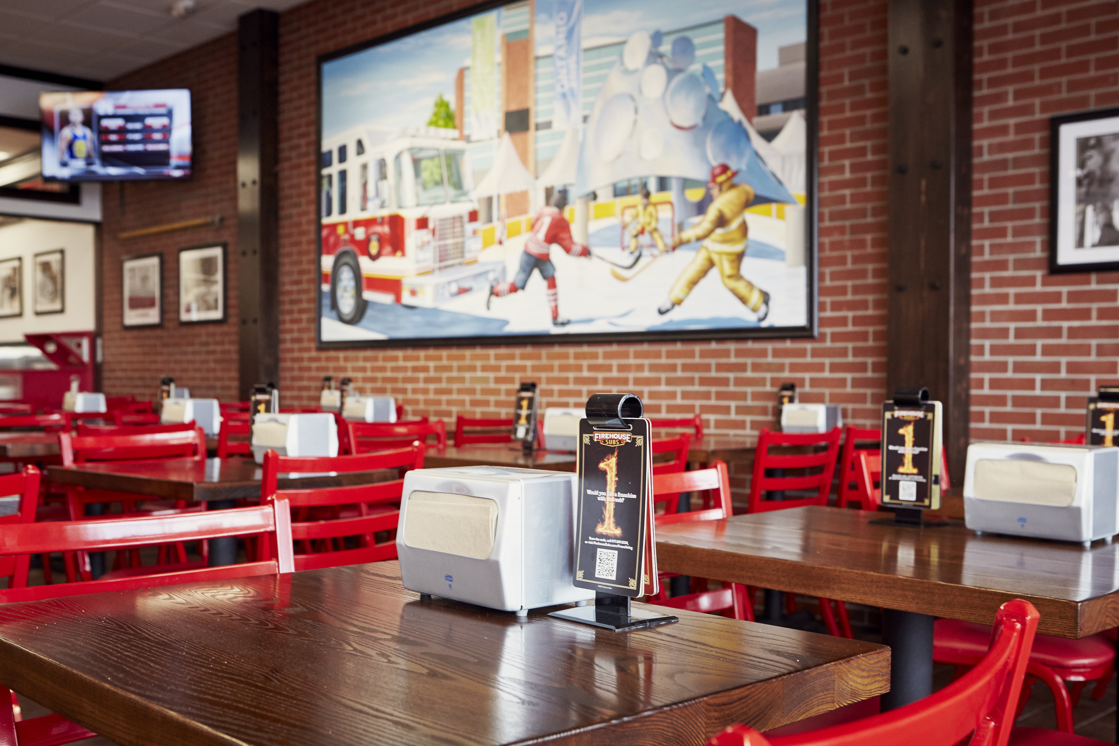 Interior photo of a restaurant's wood tables